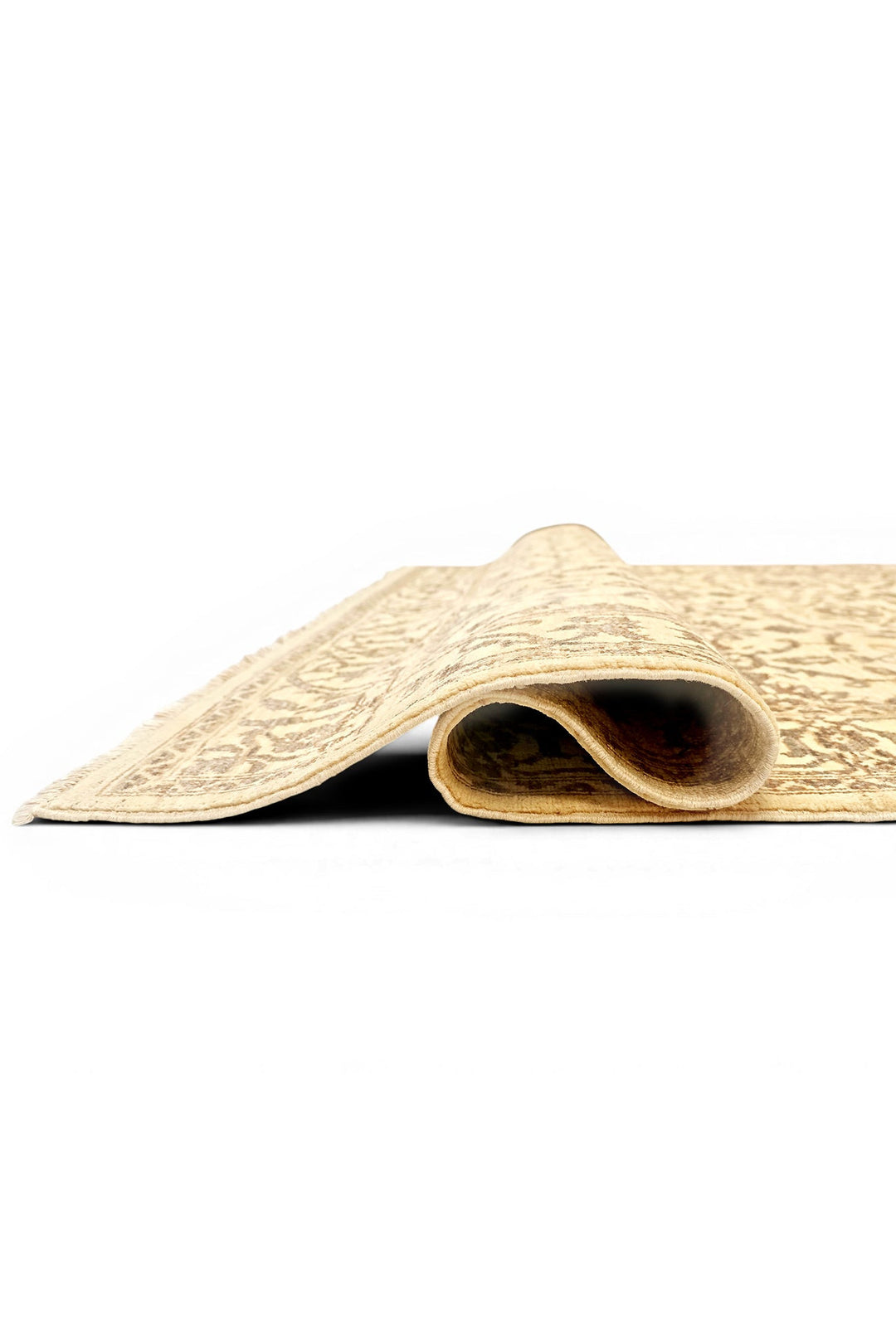 Rolled-up beige carpet on a white background