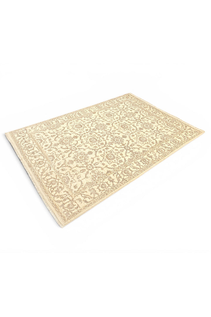 Beige patterned rug on a white background