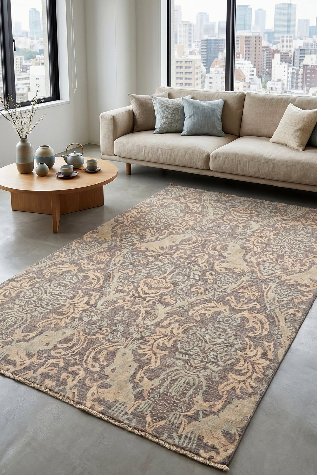 Living room with a patterned rug, beige sofa, and wooden coffee table.