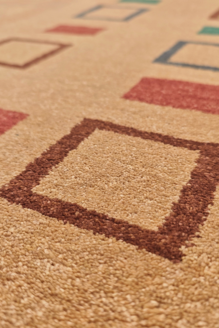 Close-up of a carpet with colorful square patterns