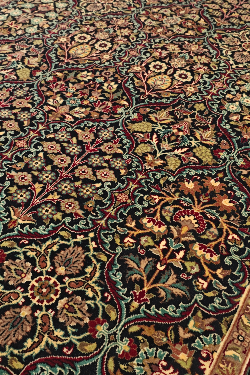 Close-up of a patterned rug with intricate designs.
