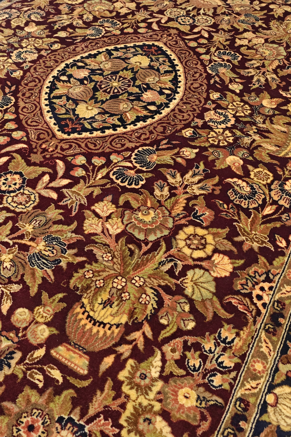 Close-up of a intricately designed floral patterned rug.