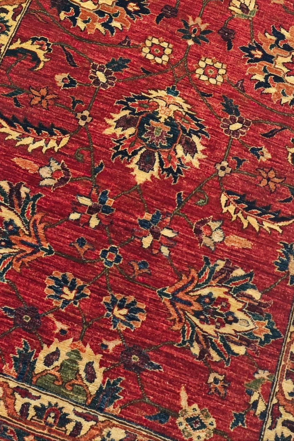 Palmette detail in red and gold on Qadeem Chobi runner