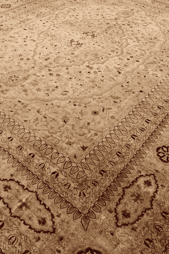 Medallion detail in wheat gold on Chobi rug