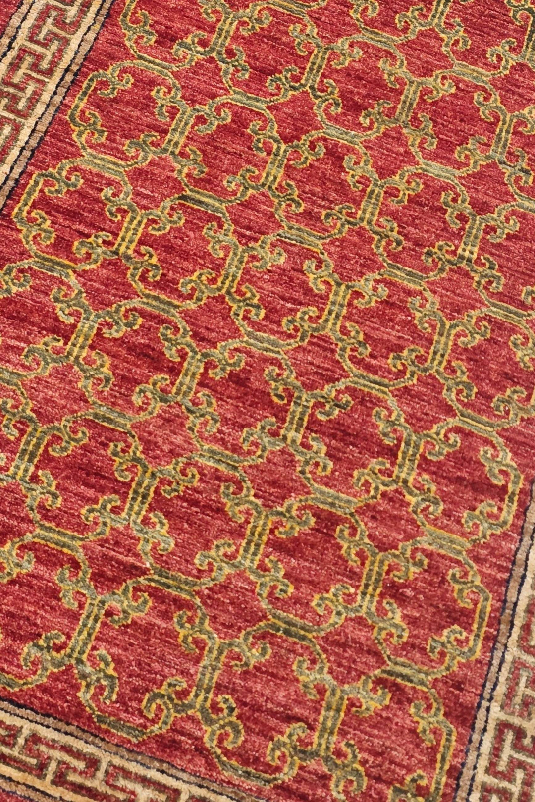 Meander lattice design in brick red and camel on Afghan runner