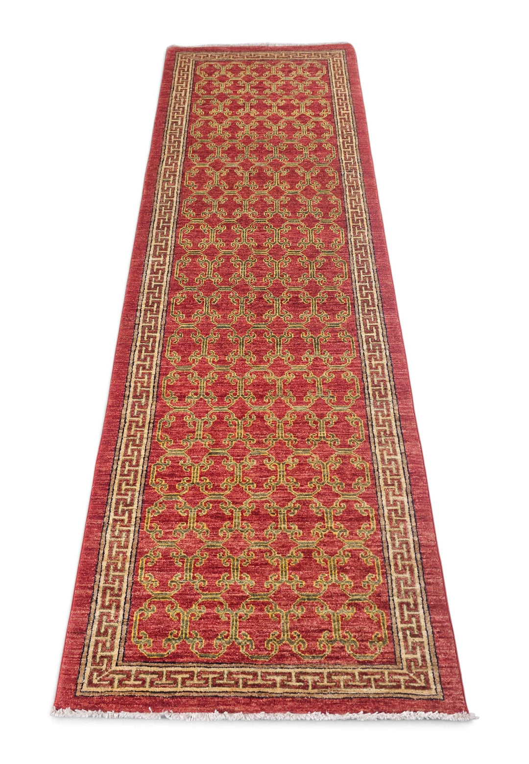 Border detail of brick red and camel hand-knotted Afghan runner