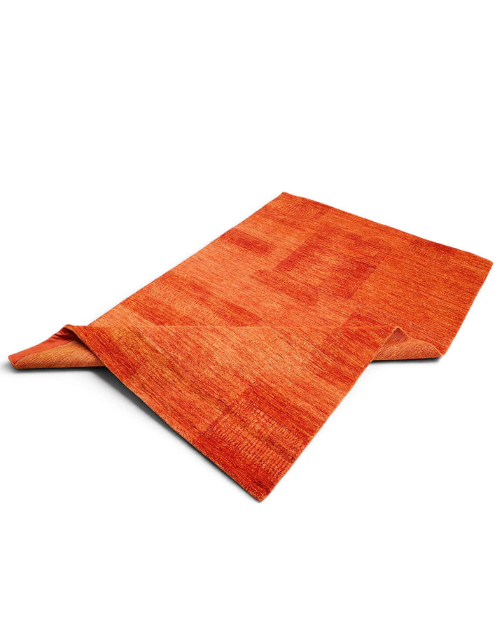 One-of-a-kind terracotta Afghan Gabbeh rug