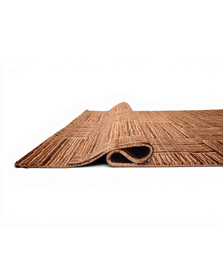 Corner of cinnamon patchwork Afghan Gabbeh wool rug
