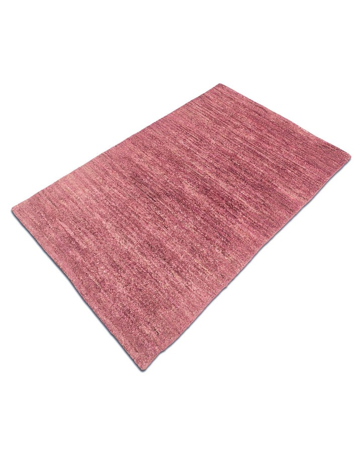 Hand-knotted wool pile of dusty mauve Gabbeh rug