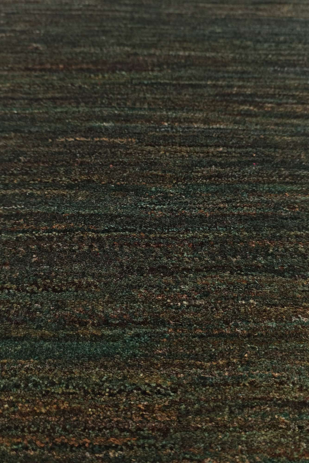 Border detail of forest green hand-knotted Afghan Gabbeh rug