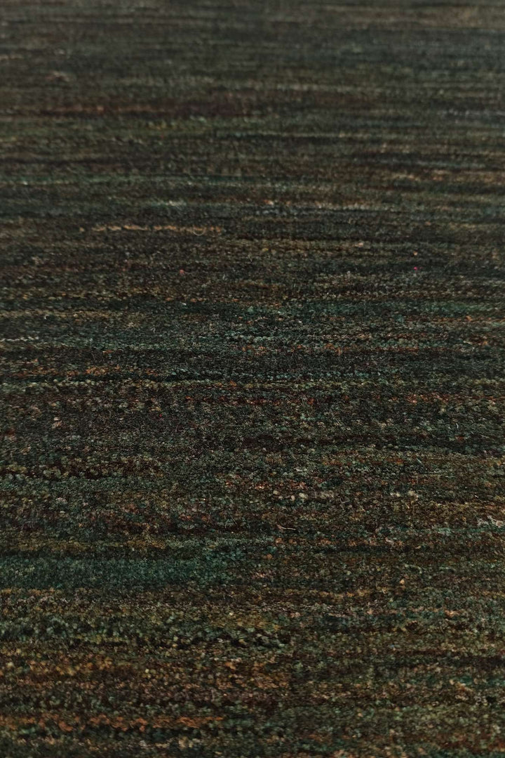 Border detail of forest green hand-knotted Afghan Gabbeh rug