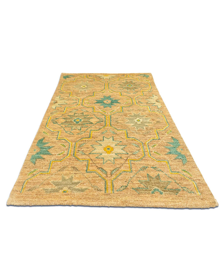 Border detail of gold and green hand-knotted Afghan Gabbeh rug