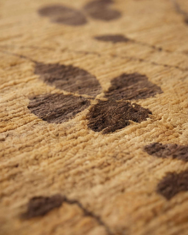 Corner of honey gold clover Afghan Gabbeh wool rug