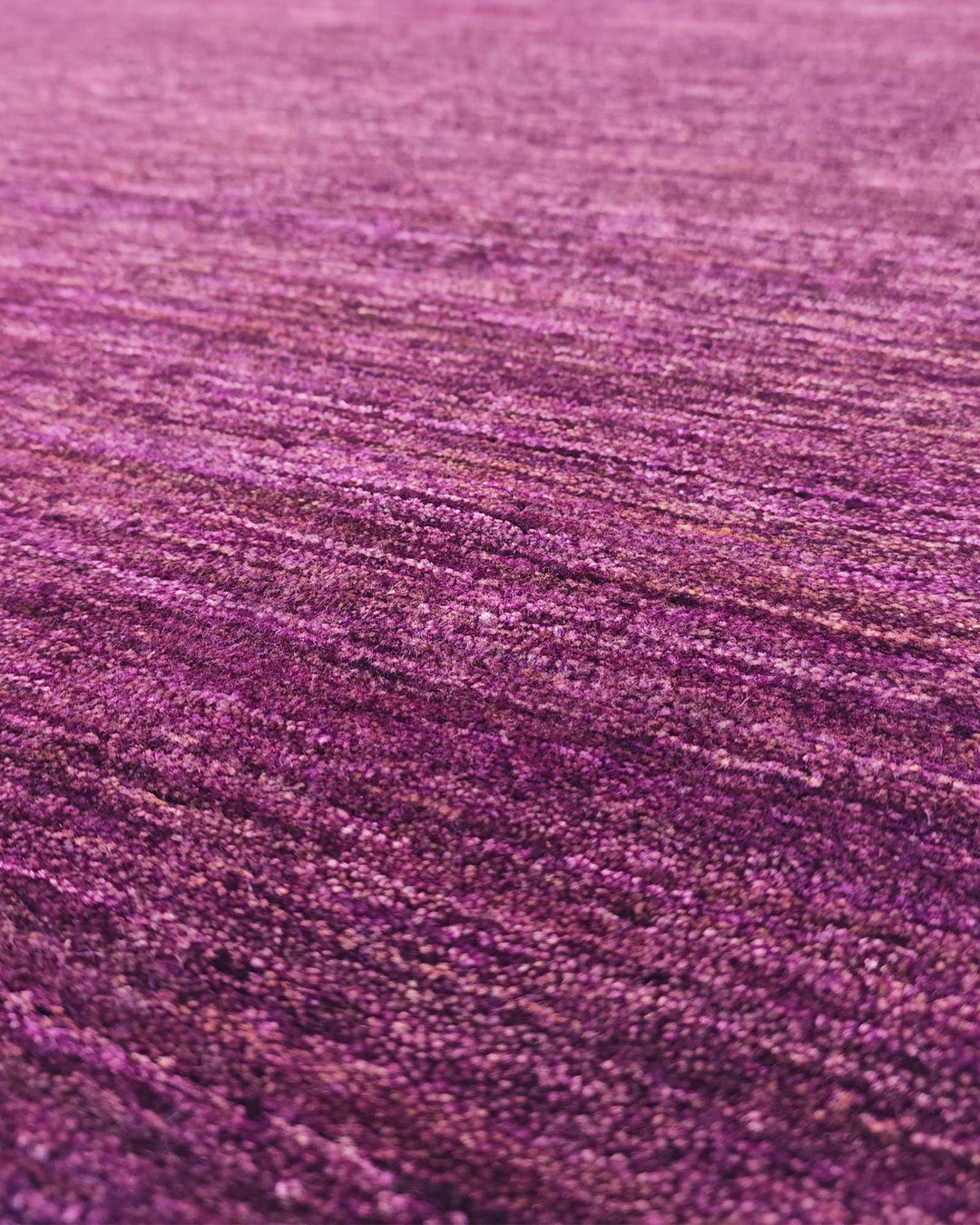 Border detail of mulberry purple hand-knotted Afghan Gabbeh rug