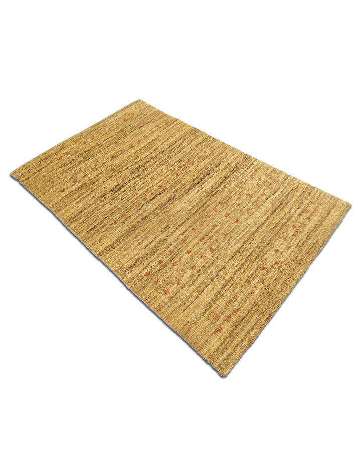 Hand-knotted wool pile of wheat gold Gabbeh rug