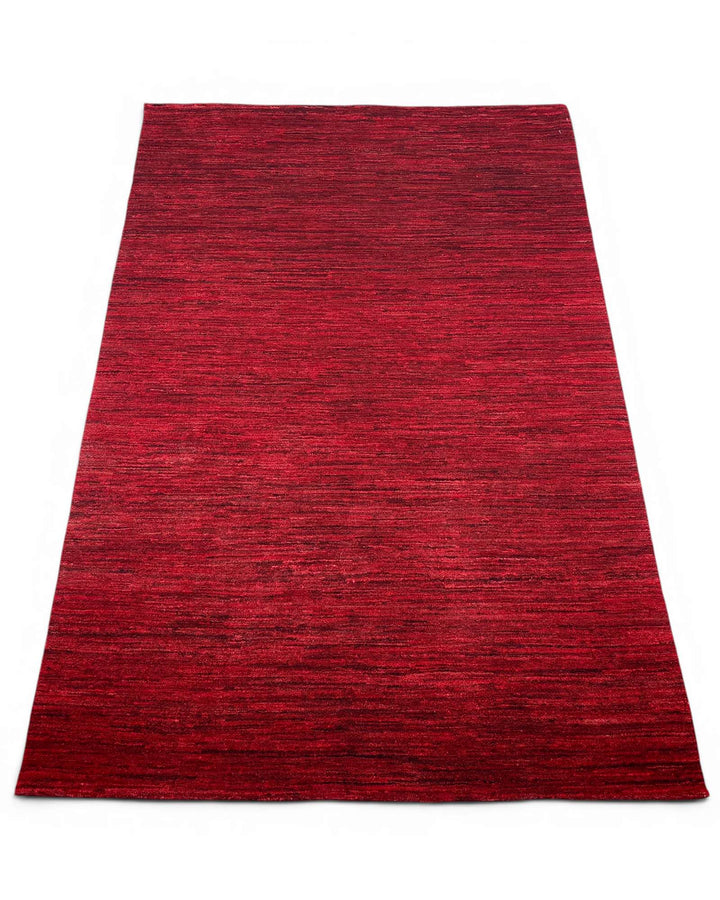 Border detail of ruby red hand-knotted Afghan Gabbeh rug