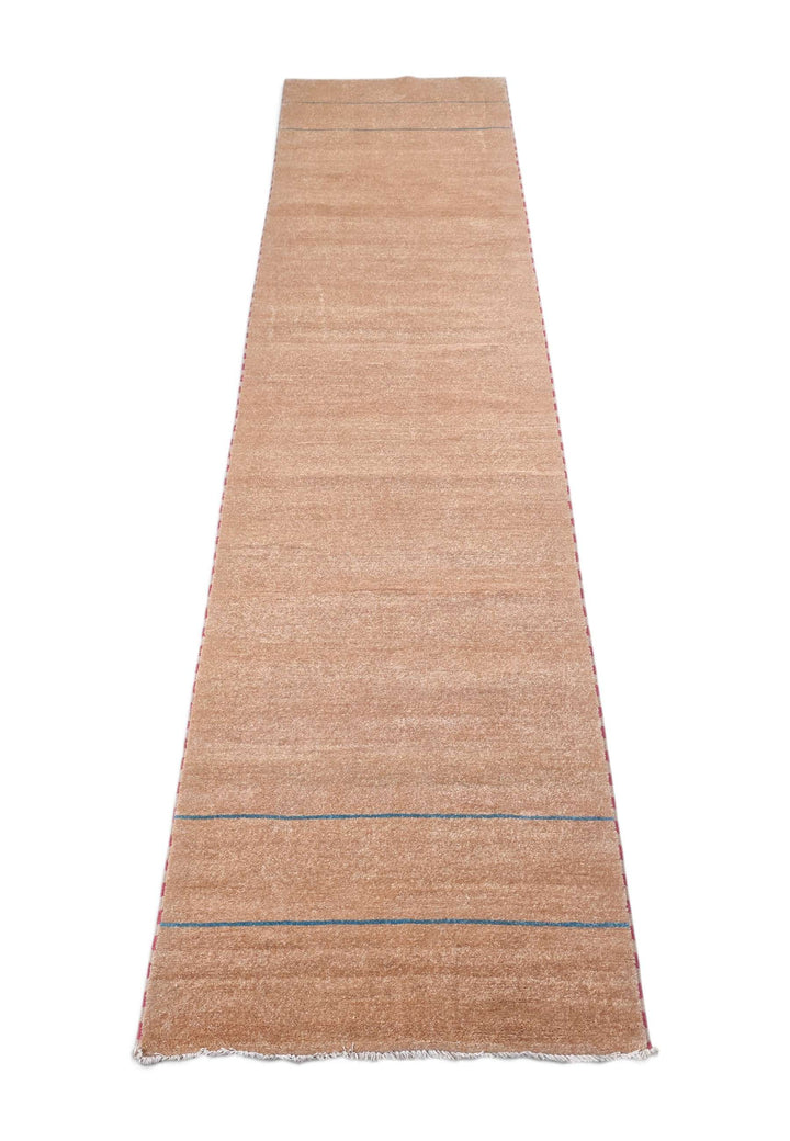 Border detail of sand and slate blue hand-knotted Gabbeh runner