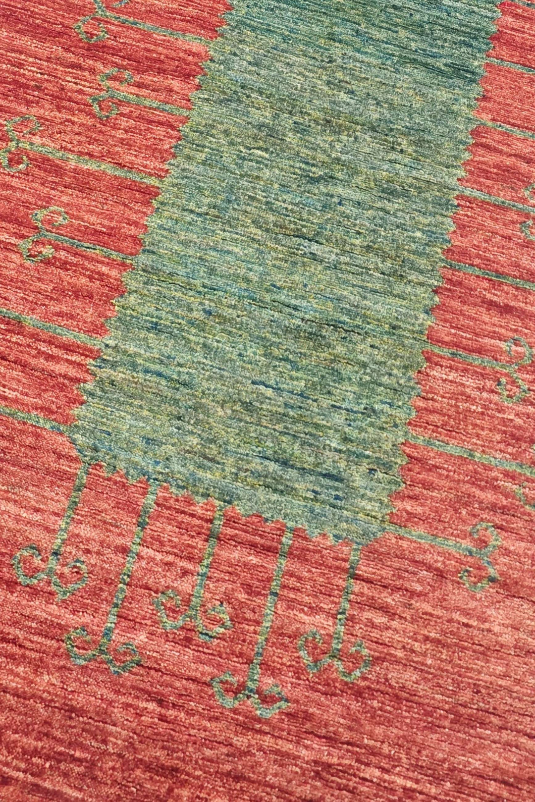 Panel design in terracotta red and green on Afghan Gabbeh runner