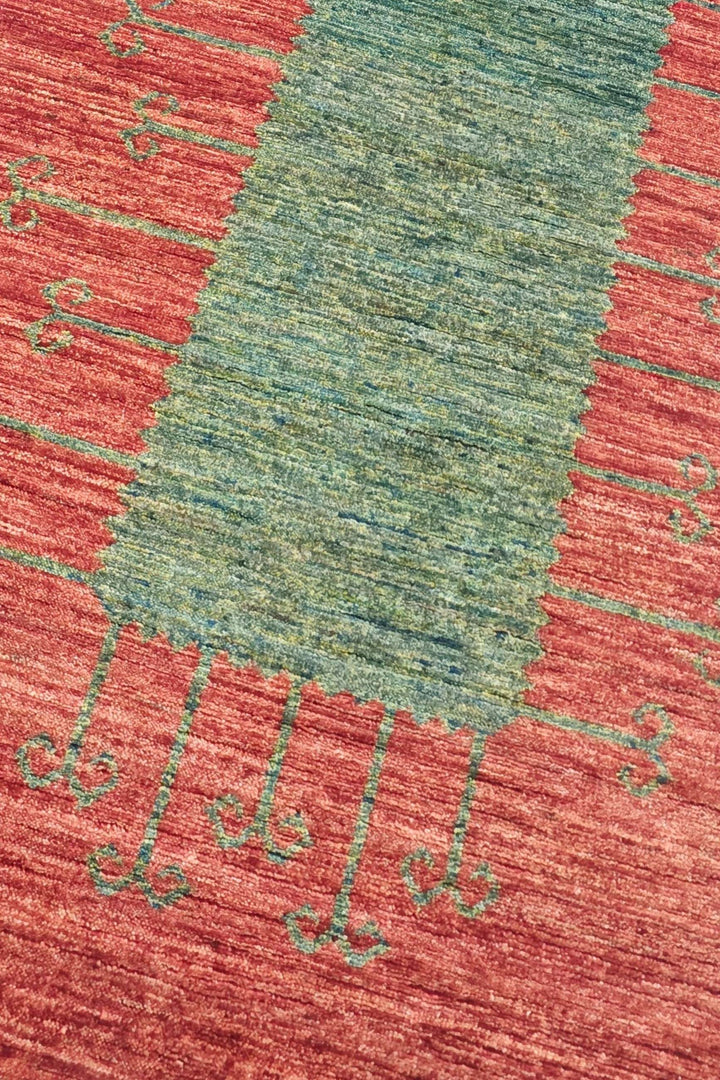 Panel design in terracotta red and green on Afghan Gabbeh runner