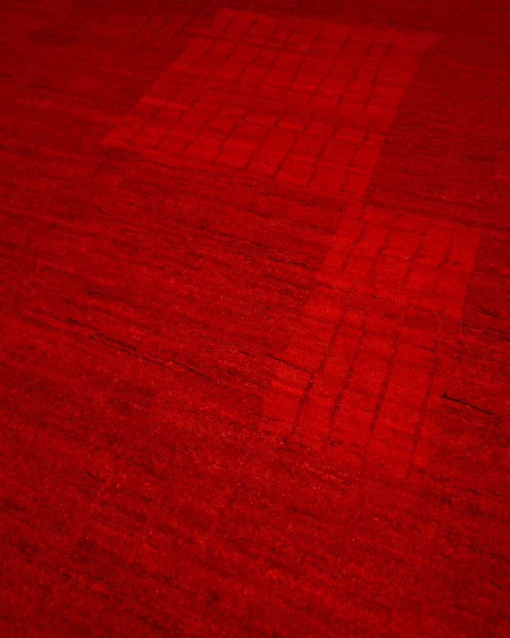 Hand-knotted wool pile of vermilion red Gabbeh rug
