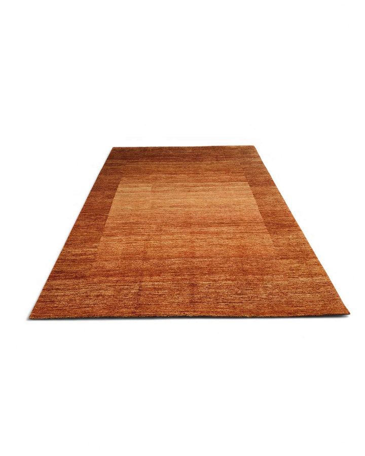 One-of-a-kind amber gold bordered Ghazni rug