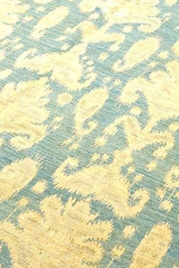 Hand-knotted Ghazni wool pile of blue gold ikat rug