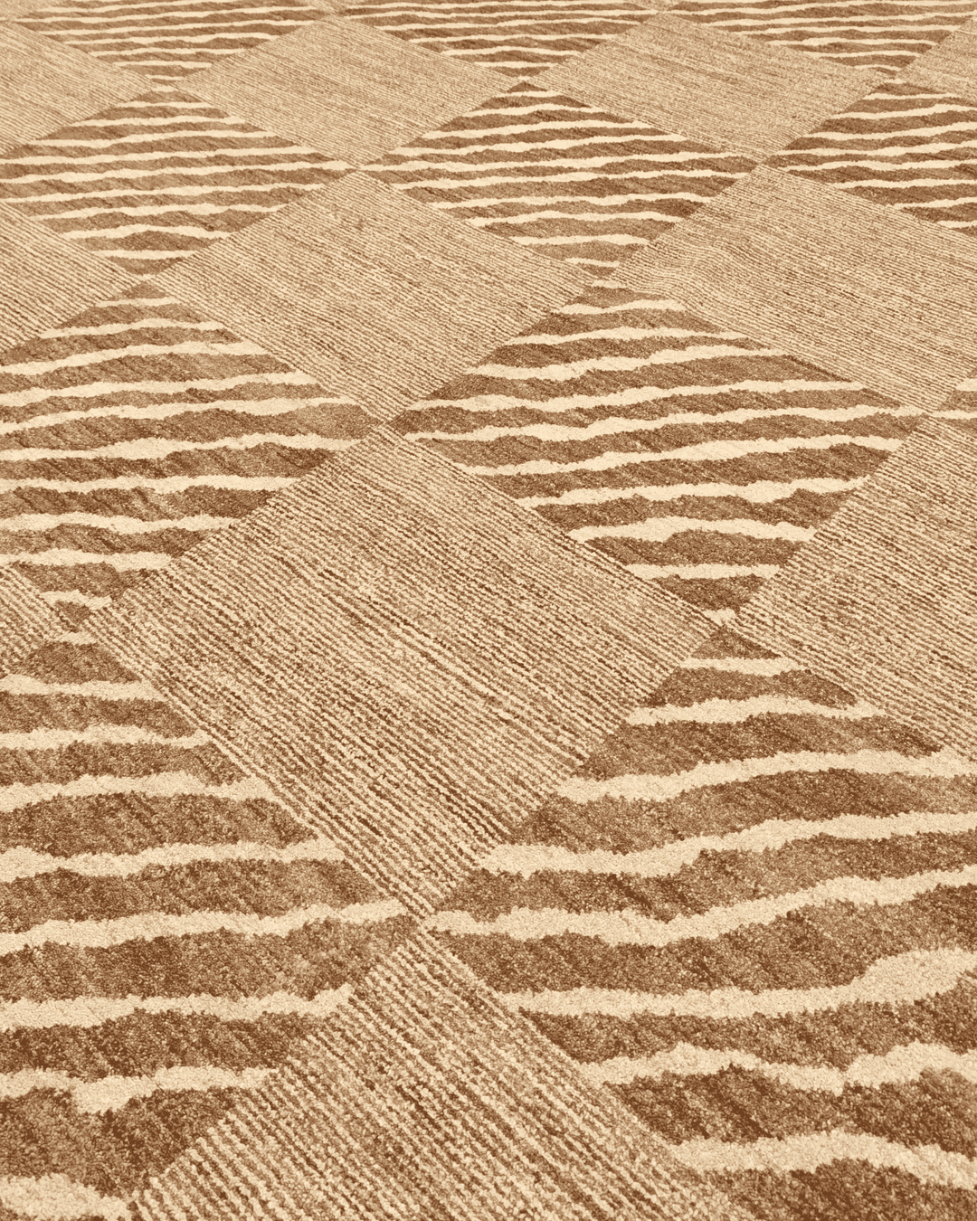 Border detail of beige ivory checkerboard Ghazni rug