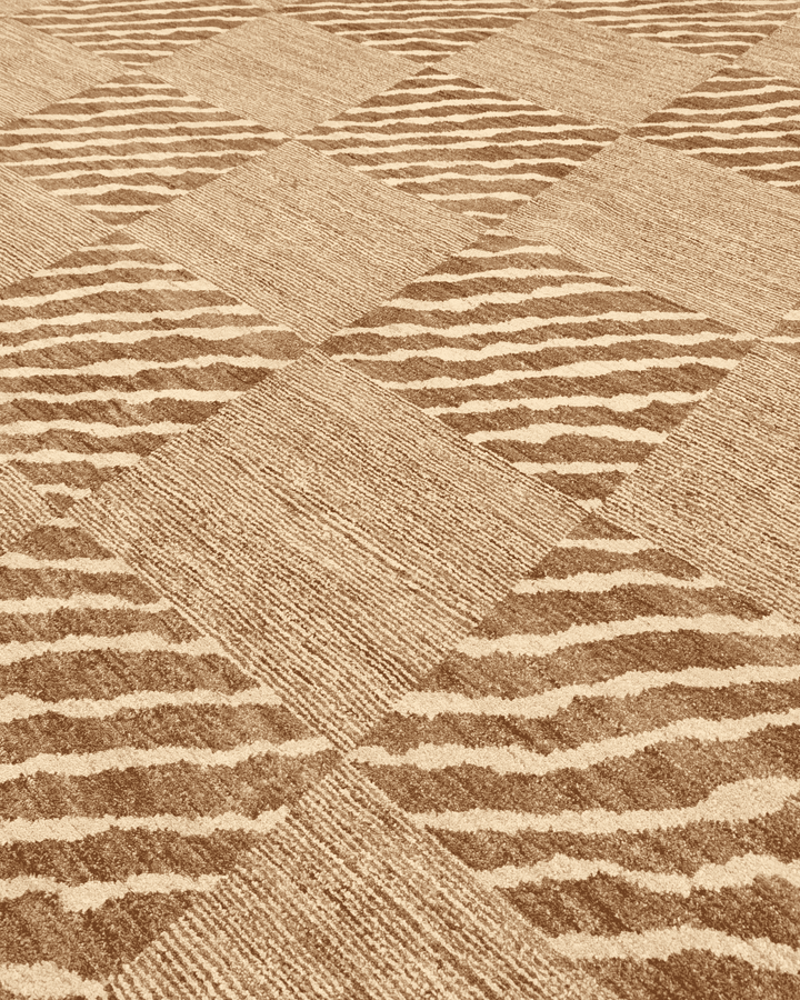 Border detail of beige ivory checkerboard Ghazni rug