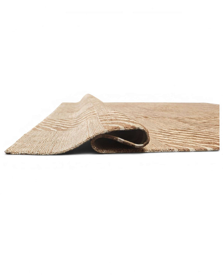 Corner of beige ivory checkerboard Ghazni hand-knotted rug