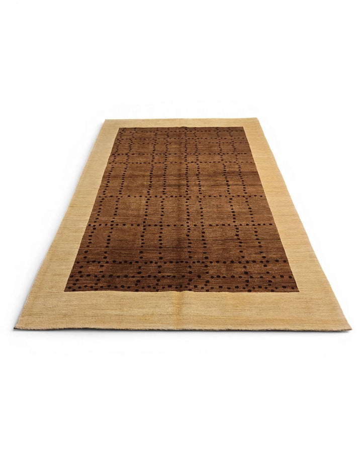 Border detail of brown cream dot-grid Ghazni rug