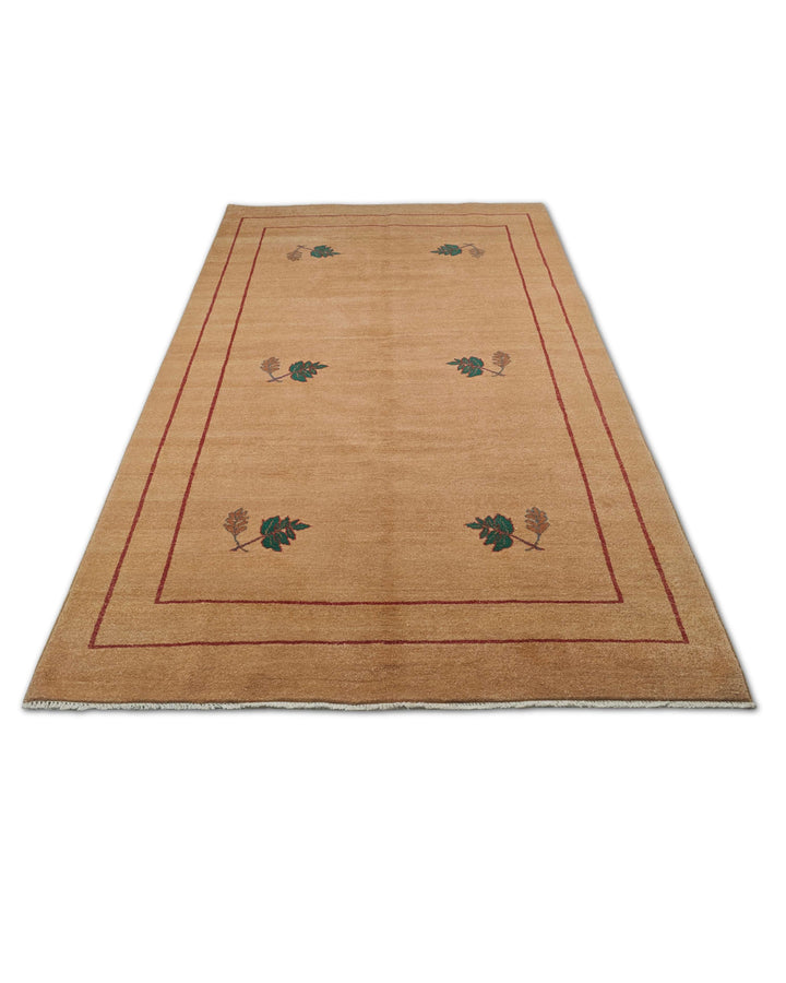 Border detail of camel green Ghazni hand-knotted rug