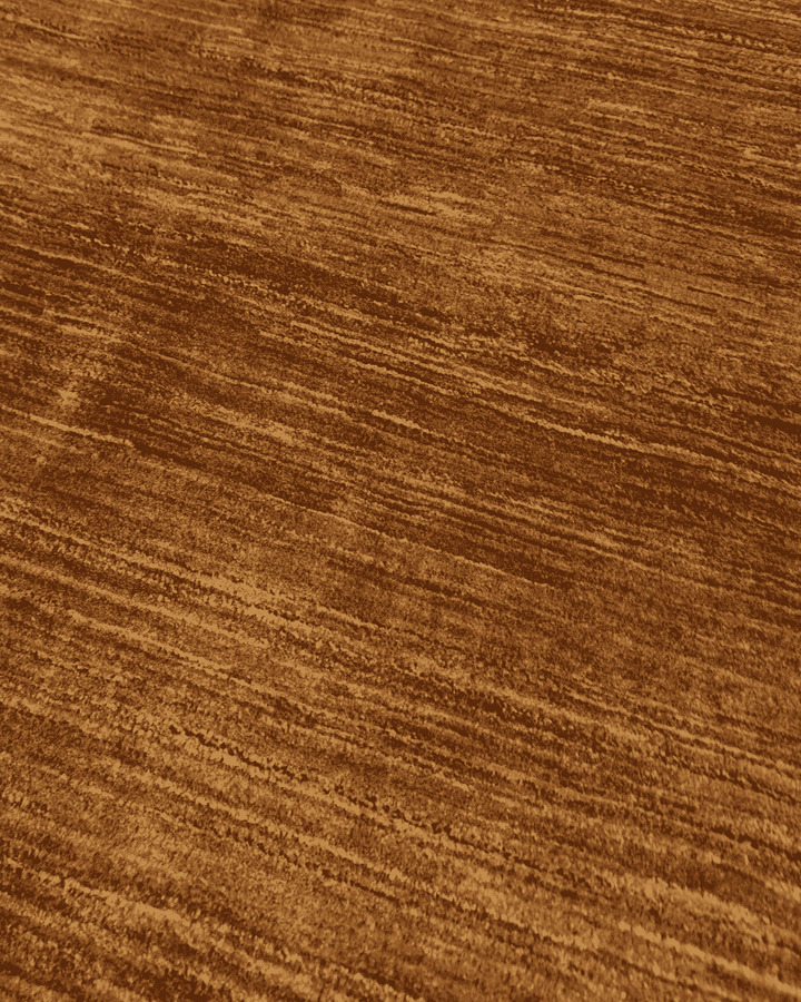 Border detail of golden brown Ghazni hand-knotted Afghan rug