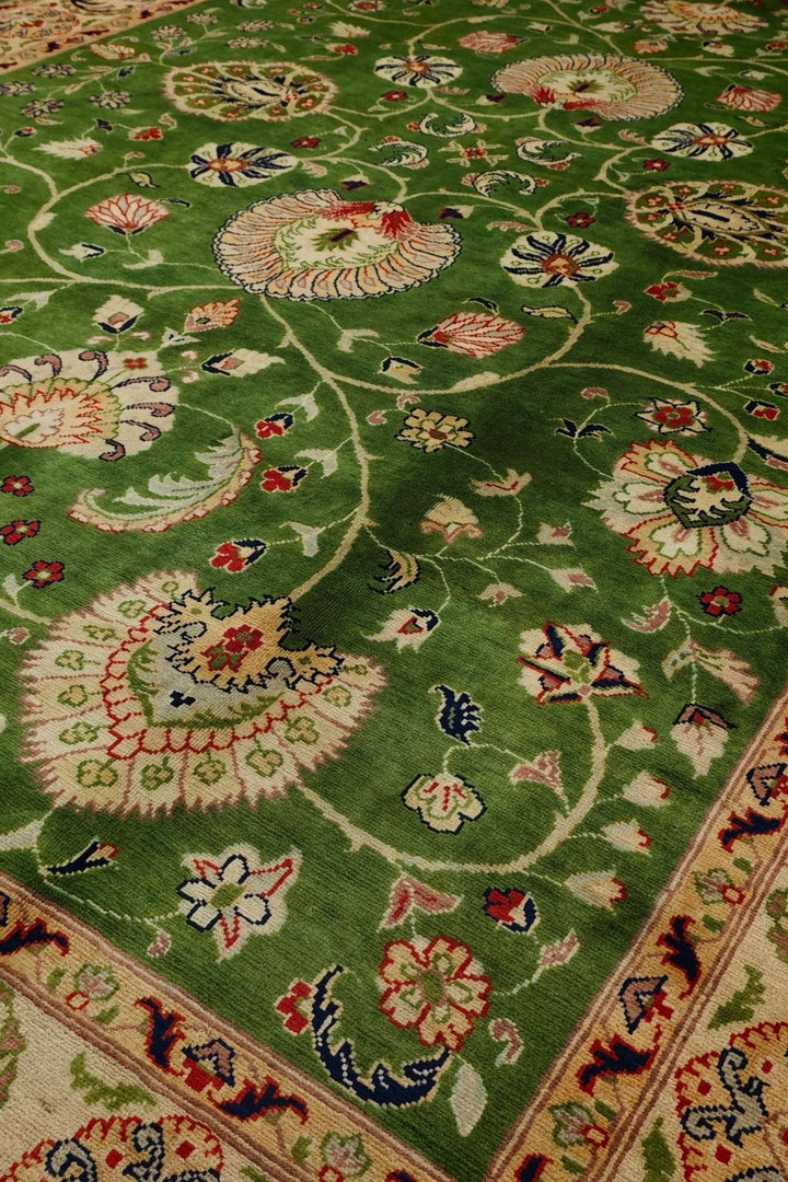 Floral detail in green on Afghan Ghazni wool rug