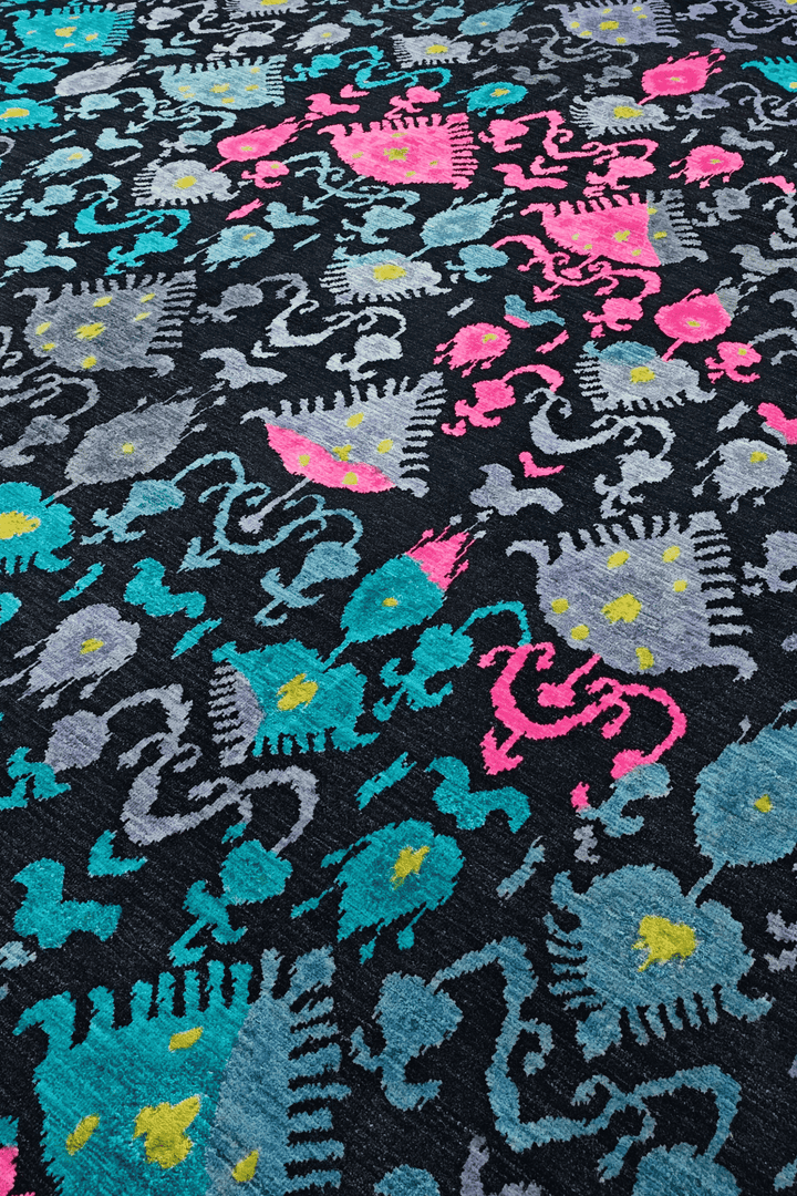 Ikat detail in indigo and magenta on Afghan Ghazni rug
