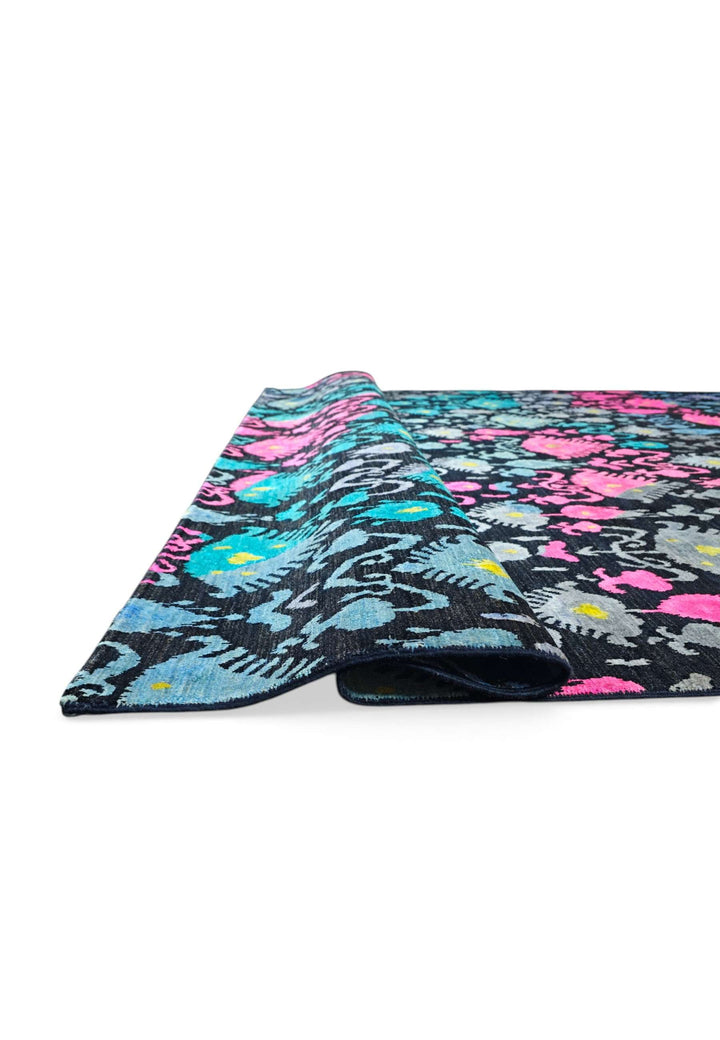 Hand-knotted indigo Ghazni rug with magenta ikat, borderless