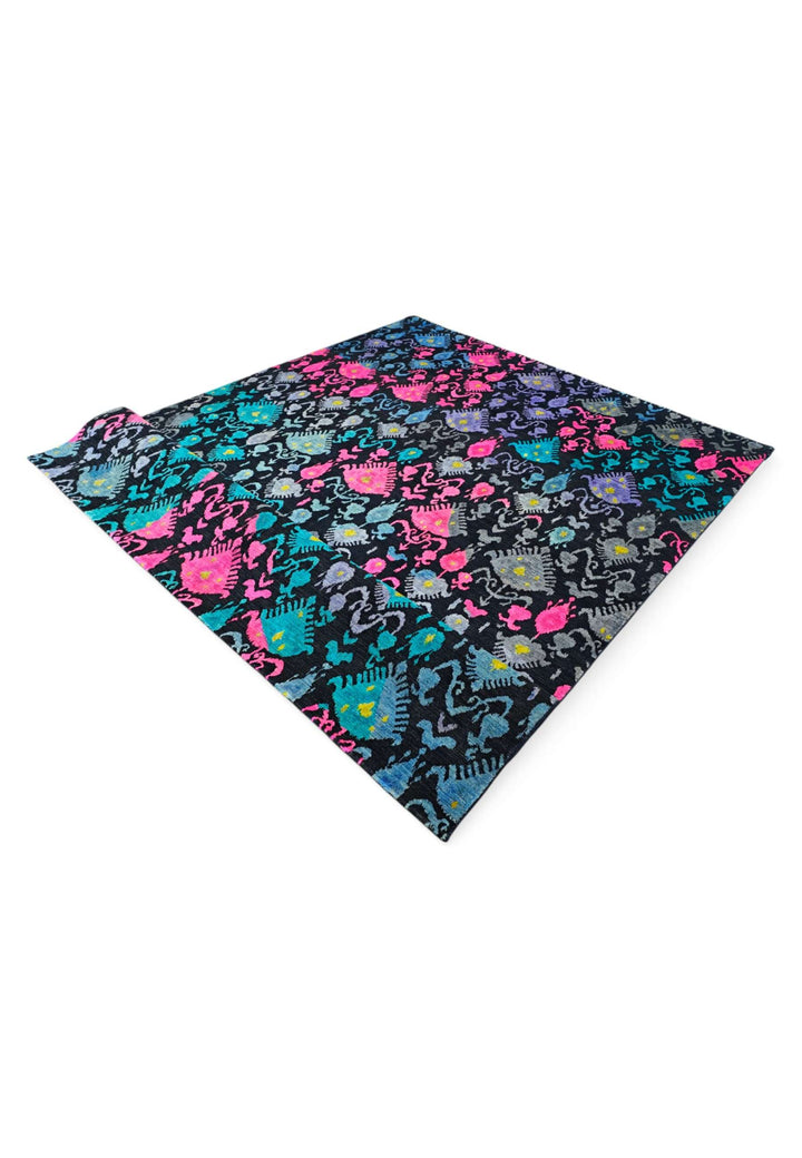 Corner of indigo magenta ikat Ghazni hand-knotted rug