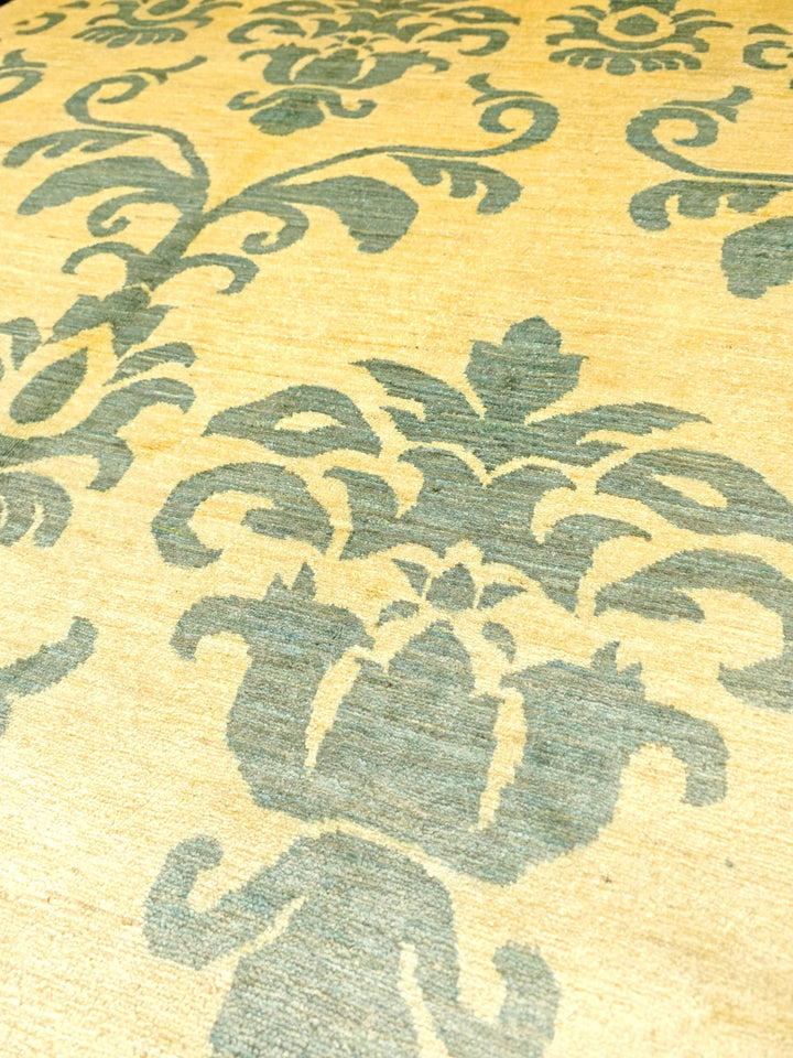 Border detail of ivory and sage Ghazni hand-knotted Afghan rug