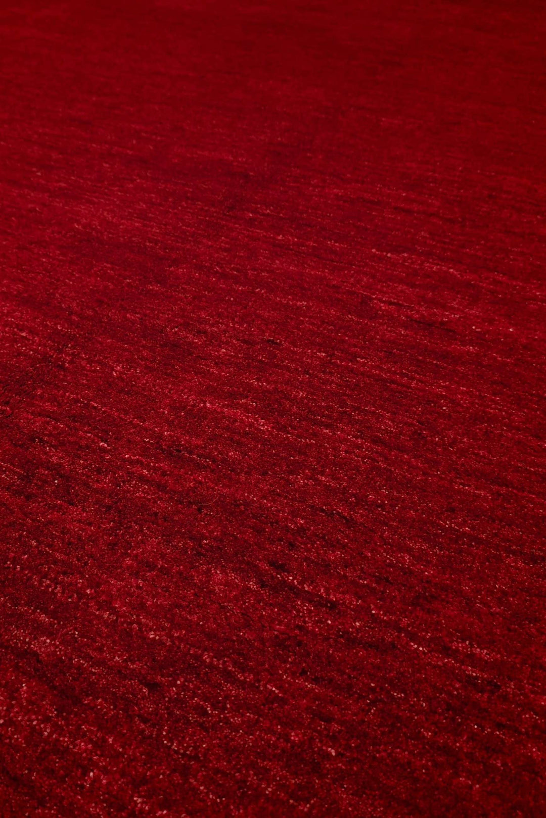 Plain field detail in madder red on Afghan Ghazni rug