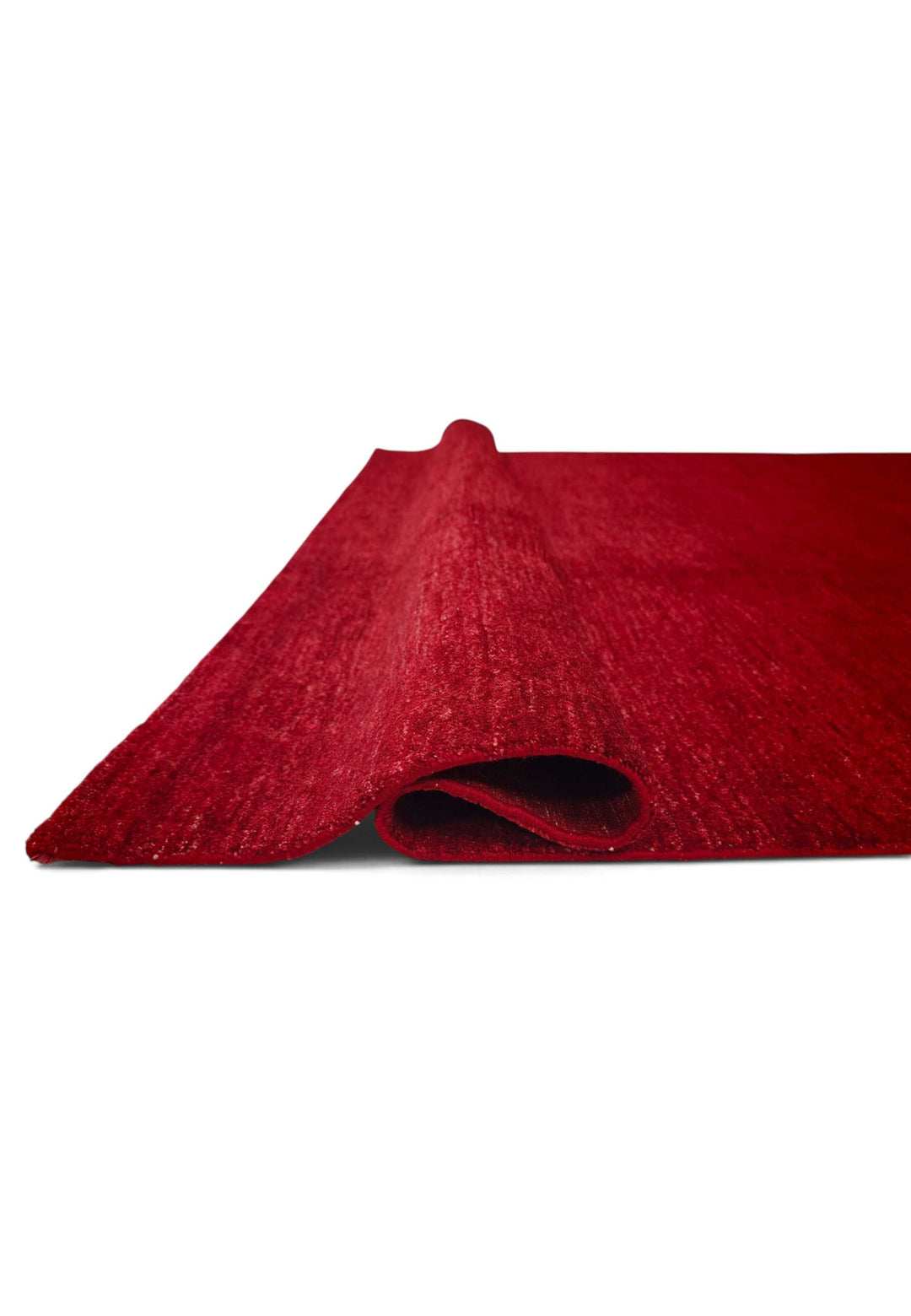 Hand-knotted madder red Ghazni rug with quiet plain field