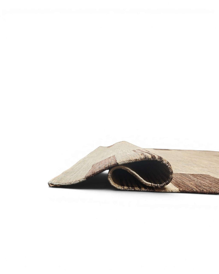 Corner of natural beige tribal border Ghazni rug