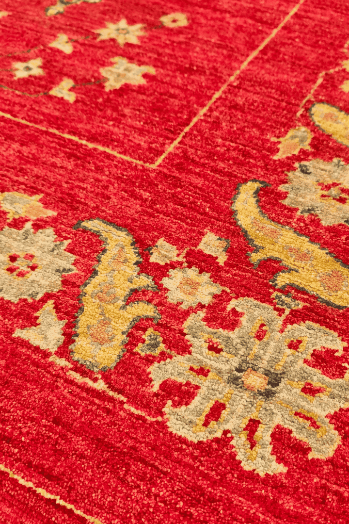 Hand-knotted wool pile of red gold Ghazni rug