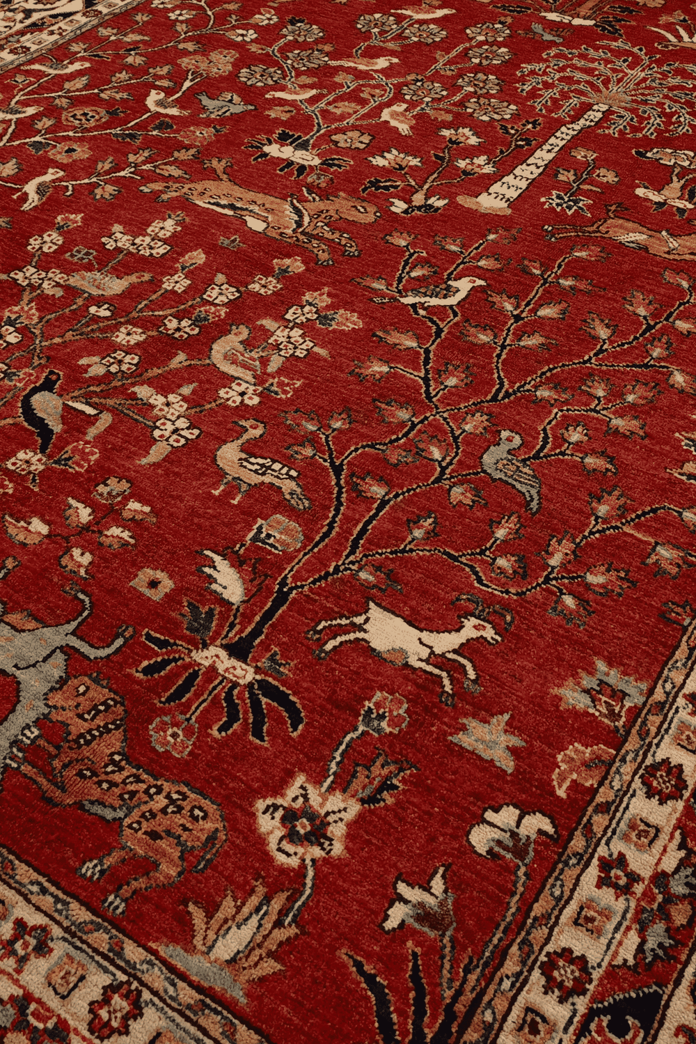 Shikargah tree of life detail with animals on red Ghazni rug