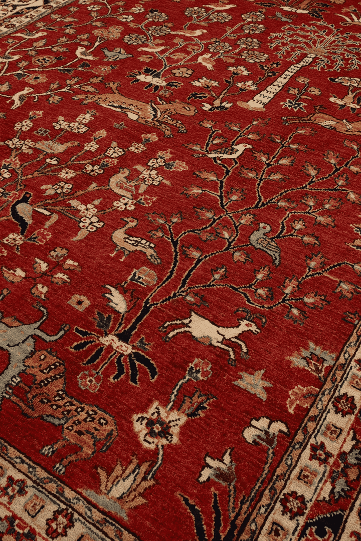 Shikargah tree of life detail with animals on red Ghazni rug
