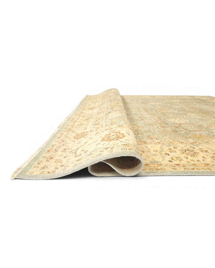 Corner of pale sage gold Ghazni hand-knotted rug