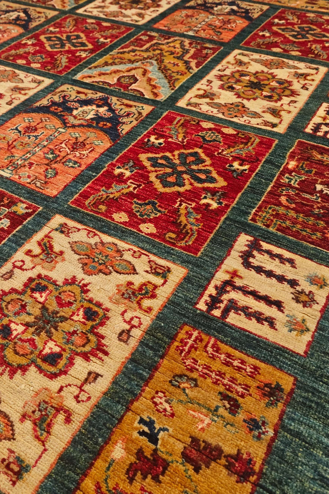Bakhtiari garden compartment detail in teal on Ghazni rug