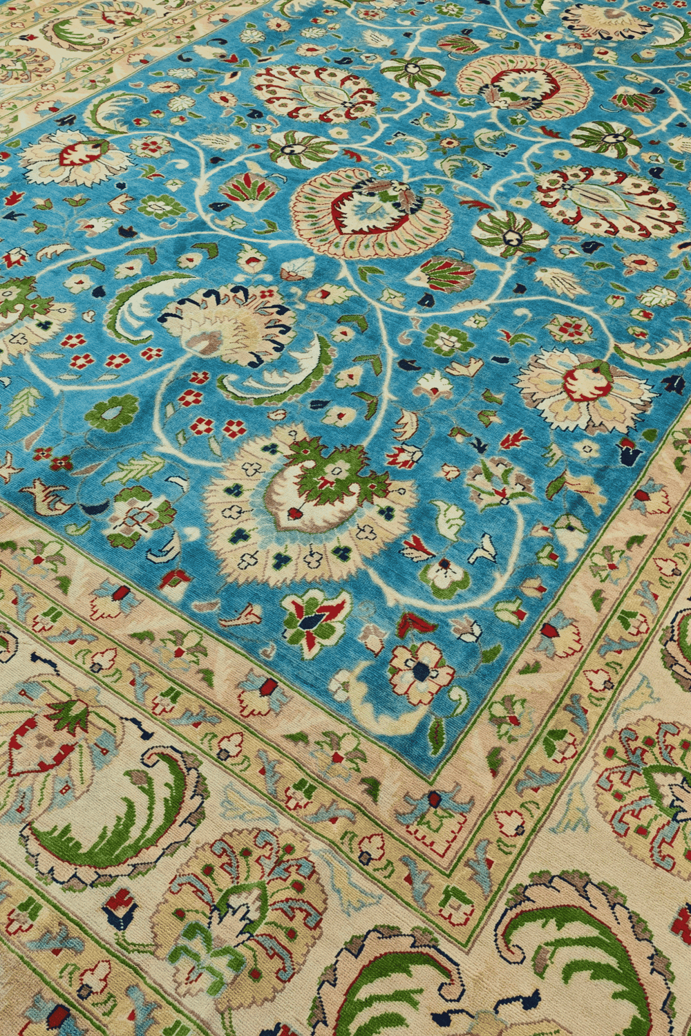 Chobi floral detail in turquoise and cream on Ghazni rug
