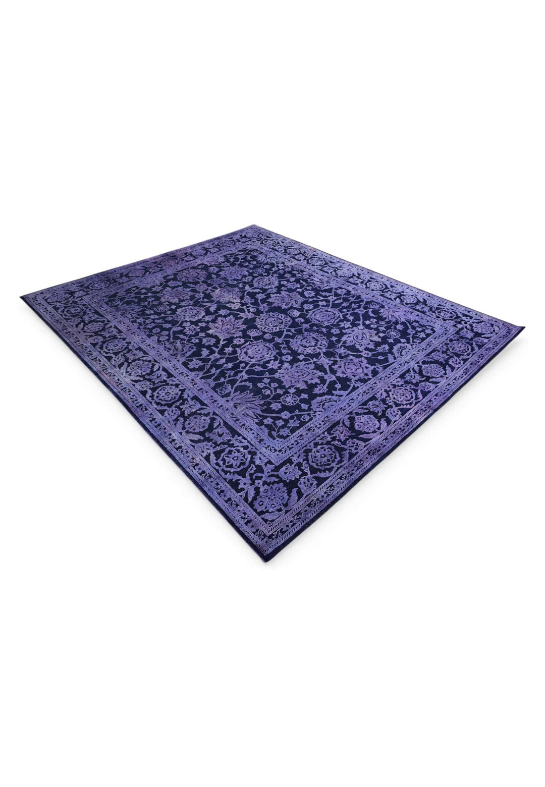 Hand-knotted wool pile of violet overdyed Ghazni rug