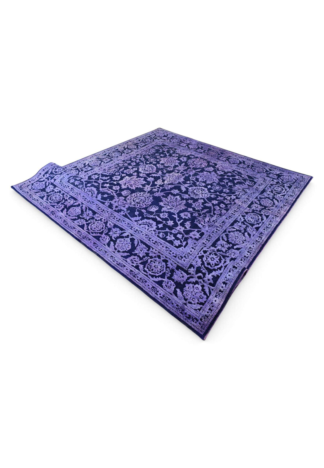 Corner of violet overdyed floral Ghazni rug