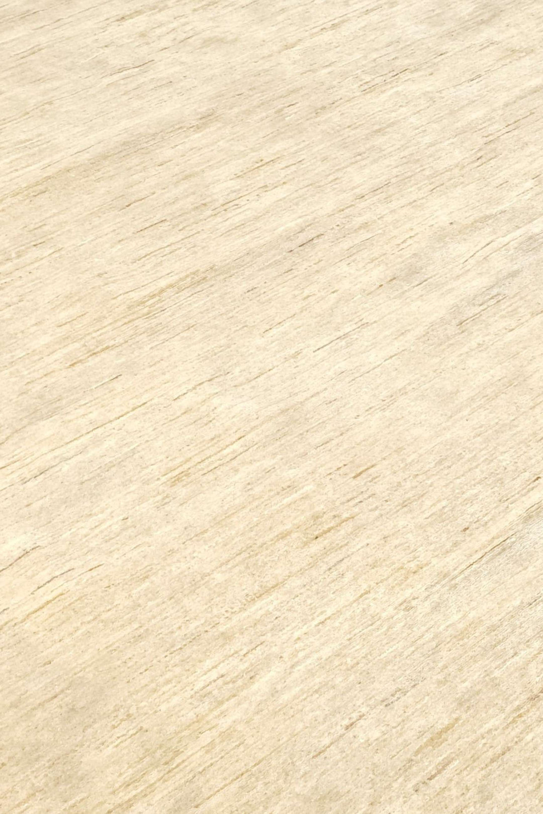 Plain field detail in warm ivory on round Ghazni rug