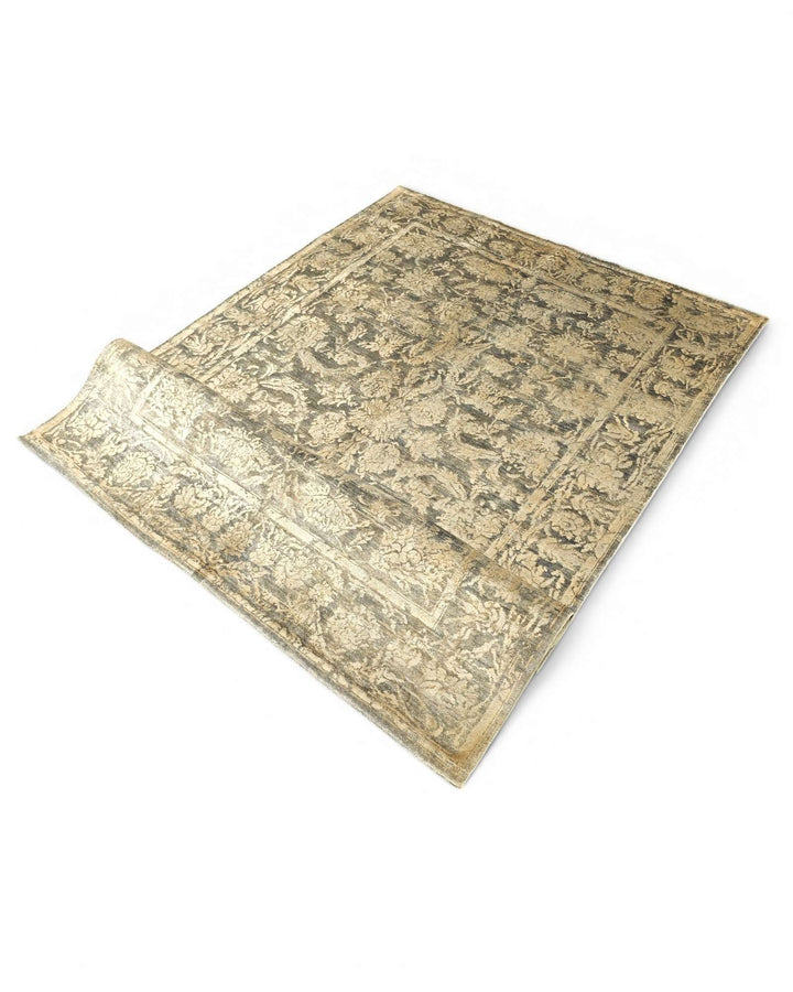 Corner of charcoal gold floral Ghazni rug